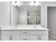 The bathroom has a glass shower door, a double sink, white quartz countertops, and tile flooring at 1823 Lynwood Ln, Atlanta, GA 30329