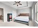 Spacious bedroom with a large bed, ample natural light, tray ceiling and a colorful dresser at 1823 Lynwood Ln, Atlanta, GA 30329