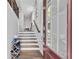 Bright entryway featuring hardwood floors, stairs, and view of a glass paneled front door at 1823 Lynwood Ln, Atlanta, GA 30329