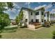 Well-maintained townhouse featuring a charming back deck and a meticulously manicured lawn in a residential community at 1823 Lynwood Ln, Atlanta, GA 30329