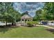 Elegant gazebo with a stone fireplace surrounded by manicured lawns, perfect for relaxation and community gatherings at 1823 Lynwood Ln, Atlanta, GA 30329