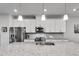 Updated kitchen with stainless steel appliances, granite countertops, tile backsplash, and sleek white cabinets at 1823 Lynwood Ln, Atlanta, GA 30329