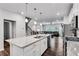 Spacious open-concept kitchen featuring a large island with seating, stainless appliances, and access to the living area at 1823 Lynwood Ln, Atlanta, GA 30329