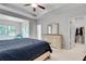This main bedroom features a ceiling fan, a walk-in closet, and large windows with ample natural light at 1823 Lynwood Ln, Atlanta, GA 30329