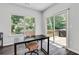 Bright home office with sliding glass doors to a deck, offering a tranquil workspace with natural light at 1823 Lynwood Ln, Atlanta, GA 30329