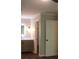 Bathroom featuring a vanity with wood cabinets, granite countertops, and a modern light fixture at 3501 Shepherds Path, Decatur, GA 30034