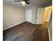 Cozy bedroom featuring modern ceiling fan, closet, and sleek dark wood flooring at 3501 Shepherds Path, Decatur, GA 30034