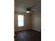 Bright bedroom featuring ceiling fan, window with blinds, and hardwood floor at 3501 Shepherds Path, Decatur, GA 30034