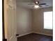 Bedroom featuring a ceiling fan, closet, and large window at 3501 Shepherds Path, Decatur, GA 30034