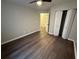 Inviting bedroom showcasing a ceiling fan, closet, and stylish dark wood flooring at 3501 Shepherds Path, Decatur, GA 30034