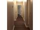 Hallway featuring modern trim, neutral paint, and dark wood flooring at 3501 Shepherds Path, Decatur, GA 30034
