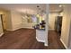 A modern living area integrates a breakfast bar and updated lighting fixtures at 3501 Shepherds Path, Decatur, GA 30034