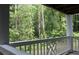 Outdoor patio with white railings and a view of lush green trees at 3501 Shepherds Path, Decatur, GA 30034