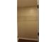 Walk-in closet featuring white wire shelving with dark laminate wood flooring at 3501 Shepherds Path, Decatur, GA 30034