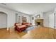 Bright living room with hardwood floors, stone fireplace, and a large window for natural light at 1544 Brewer Sw Blvd, Atlanta, GA 30310