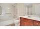 Well-lit bathroom includes a tub/shower and wooden vanity with sink at 230 E Ponce De Leon Ave # 116, Decatur, GA 30030
