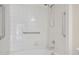 Close up of well-lit shower/tub area with accessible grab bars at 230 E Ponce De Leon Ave # 116, Decatur, GA 30030