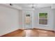 Bright bedroom with hardwood floors, ceiling fan, and a door to a balcony at 230 E Ponce De Leon Ave # 116, Decatur, GA 30030