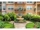 Attractive condominium exterior with fountain, beautiful landscaping and multiple balconies at 230 E Ponce De Leon Ave # 116, Decatur, GA 30030