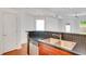 Kitchen featuring stainless appliances, wood cabinets, and bar seating area at 230 E Ponce De Leon Ave # 116, Decatur, GA 30030