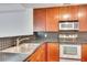 Spacious kitchen featuring stainless steel appliances, wood cabinets and a backsplash at 230 E Ponce De Leon Ave # 116, Decatur, GA 30030