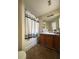 Bright bathroom with a shower-tub combination and vanity at 2390 Coach Way, Jonesboro, GA 30236