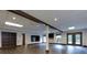 Finished basement with vinyl floors, recessed lighting, and a dark wood accent beam at 360 Hannaford Dr, Roswell, GA 30075