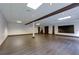 Finished basement includes vinyl floors, recessed lights, and a dark wood accent beam at 360 Hannaford Dr, Roswell, GA 30075