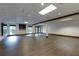 Large finished basement with vinyl floors, recessed lights, and a dark wood accent beam at 360 Hannaford Dr, Roswell, GA 30075