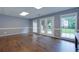 Finished basement features vinyl floors, recessed lighting, and glass panel patio doors at 360 Hannaford Dr, Roswell, GA 30075