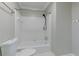 Bathroom features a shower-tub combo with white tile and fixtures at 360 Hannaford Dr, Roswell, GA 30075