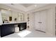 Bright bathroom with marble floors, dual vanities, makeup table, and large double door closet at 360 Hannaford Dr, Roswell, GA 30075