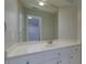 Bathroom vanity features a white countertop, undermount sink, and brushed nickel hardware at 360 Hannaford Dr, Roswell, GA 30075
