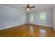 Spacious bedroom features hardwood floors, crown molding, and natural light at 360 Hannaford Dr, Roswell, GA 30075