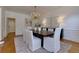 Elegant dining room featuring hardwood floors and a striking chandelier at 360 Hannaford Dr, Roswell, GA 30075