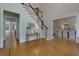 Open foyer with hardwood floors, stairs and entrance to formal dining room at 360 Hannaford Dr, Roswell, GA 30075