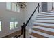 Grand foyer showcasing hardwood floors, staircase, front doors and large windows at 360 Hannaford Dr, Roswell, GA 30075