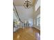 Grand foyer with high ceilings, a staircase, and views into the dining room at 360 Hannaford Dr, Roswell, GA 30075