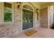 Inviting front entryway with double doors and stylish lighting fixtures at 360 Hannaford Dr, Roswell, GA 30075