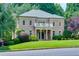 Charming brick home with lush landscaping and a welcoming front porch at 360 Hannaford Dr, Roswell, GA 30075