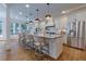 Bright kitchen with a granite island and seating for casual dining at 360 Hannaford Dr, Roswell, GA 30075