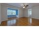 Spacious living room featuring hardwood floors, a ceiling fan, and a built-in window seat at 360 Hannaford Dr, Roswell, GA 30075