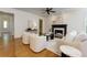 Inviting living room with a fireplace, hardwood floors, and lots of natural light at 360 Hannaford Dr, Roswell, GA 30075