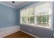 Bright sitting area features a built-in bench beneath a large window with wood blinds at 360 Hannaford Dr, Roswell, GA 30075