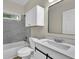 Bright bathroom featuring gray tile backsplash, white cabinets, and sleek vanity at 1249 Creek Forest Ln # Bldg 8, Austell, GA 30106