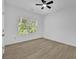 Inviting bedroom with a ceiling fan, and a window showcasing a private outdoor view at 1249 Creek Forest Ln # Bldg 8, Austell, GA 30106