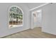 Bright entryway showcasing an arched window and pristine white walls at 1249 Creek Forest Ln # Bldg 8, Austell, GA 30106