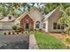 Charming home featuring a brick entryway, manicured lawn, and mature landscaping at 1249 Creek Forest Ln # Bldg 8, Austell, GA 30106