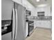 Kitchen with stainless steel refrigerator and modern microwave at 1249 Creek Forest Ln # Bldg 8, Austell, GA 30106