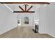 Vaulted living room featuring a fireplace, wood beams, and large arched window at 1249 Creek Forest Ln # Bldg 8, Austell, GA 30106